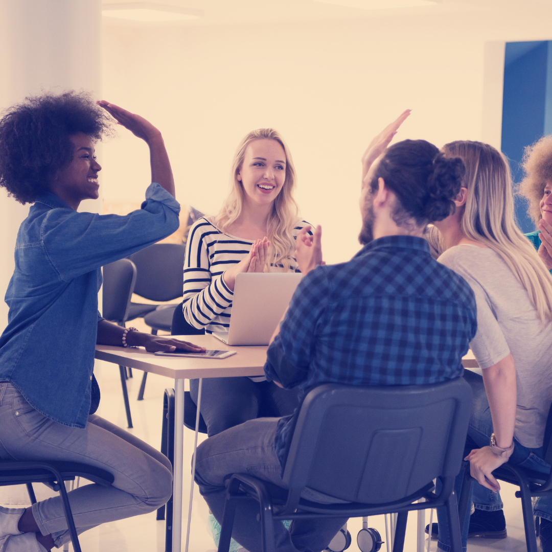 people happy at team meeting