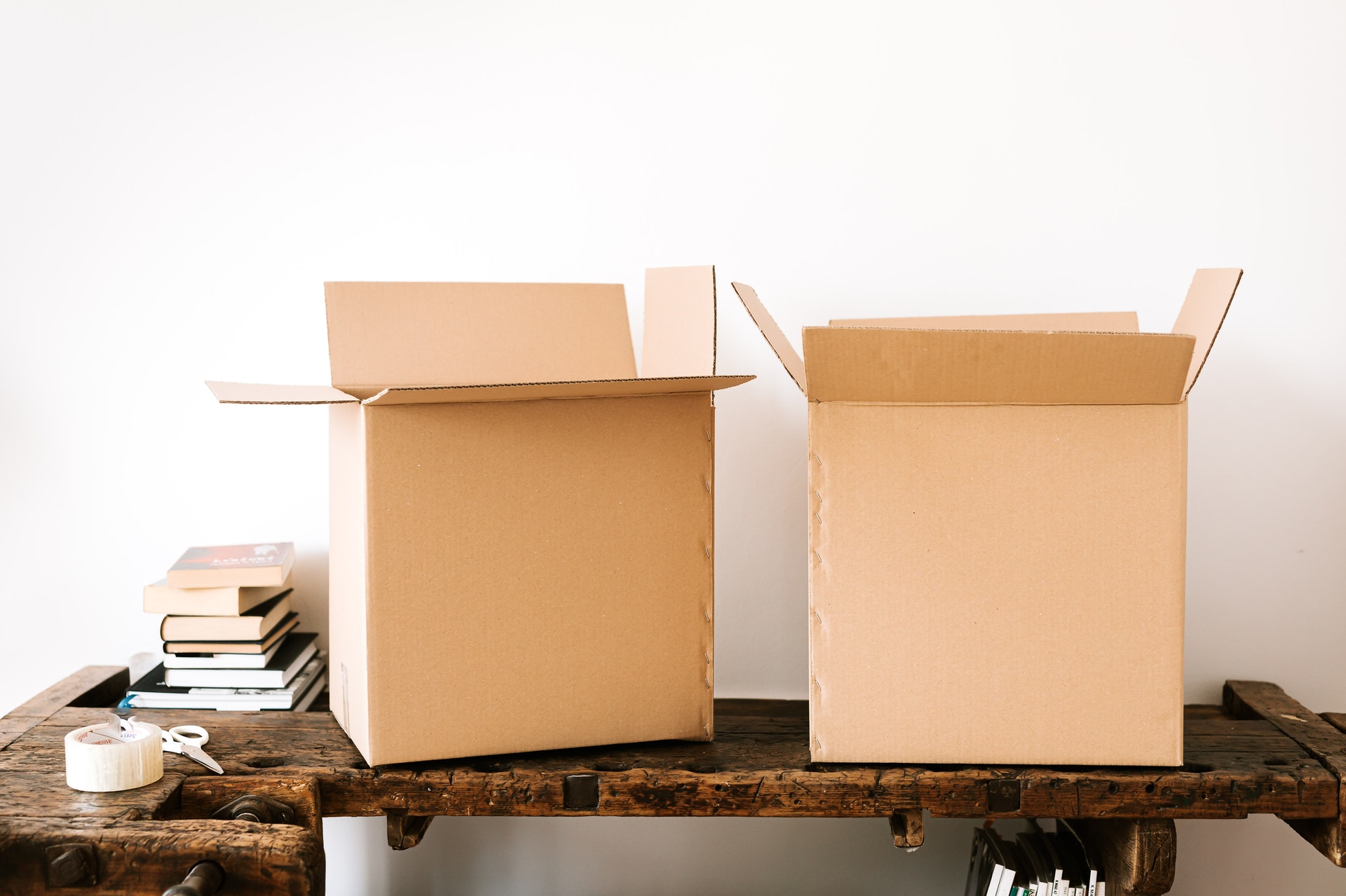 Moving boxes on wooden surface