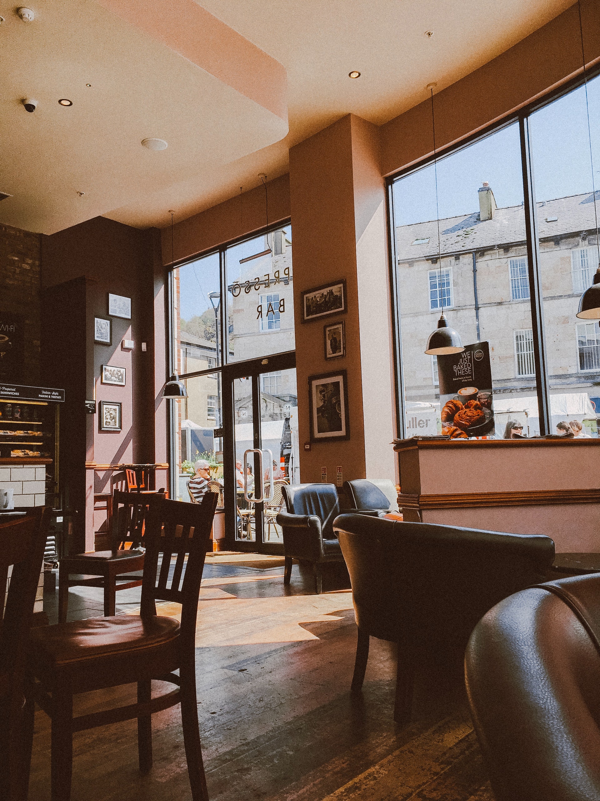 Interior of cafe with brown furniture and floor