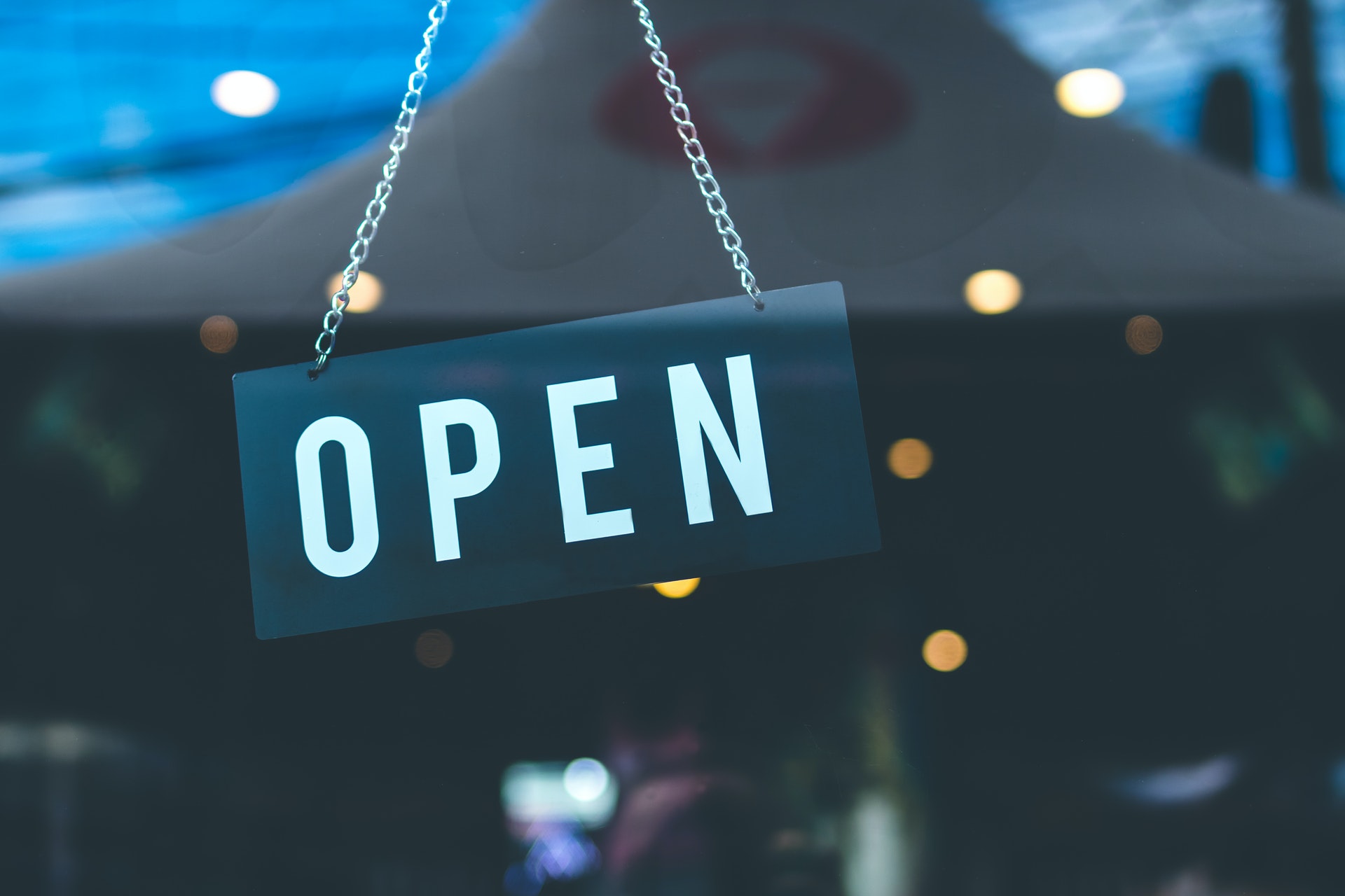 open sign hanging in window